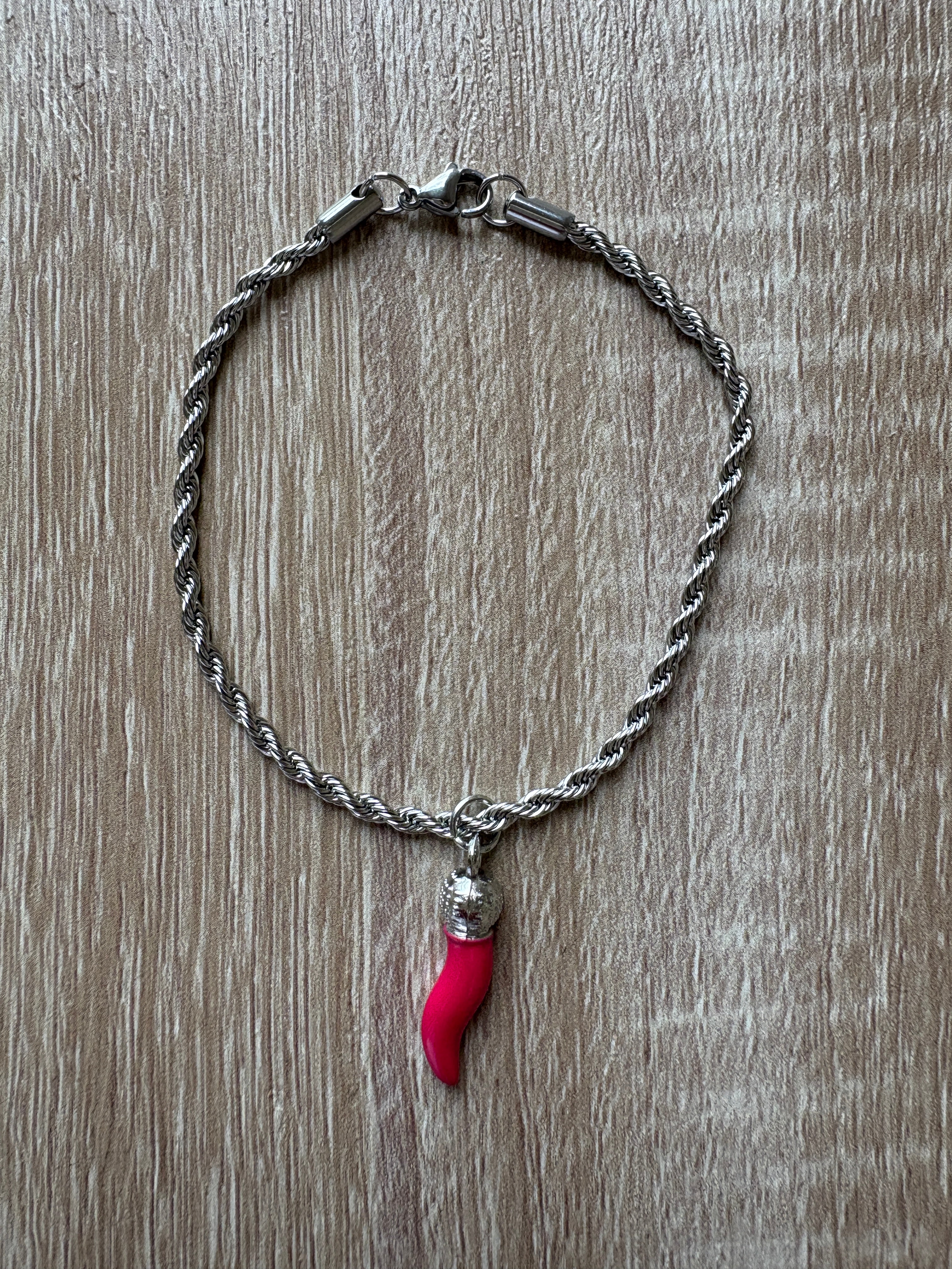 Bracciale maglia marina con corno fucsia
